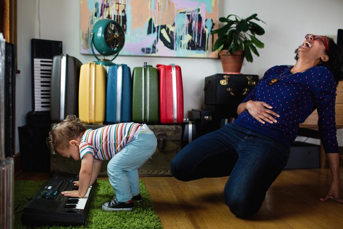 kid playing keyboard