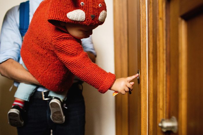 kid with doorbell